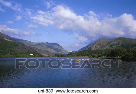Lake and Yellow Boats at Llanberis Snowdonia National Park Wales UK View Large Photo Image Stock Photo - Lake and Yellow Boats at Llanberis Snowdonia National Park Wales UK. Fotosearch