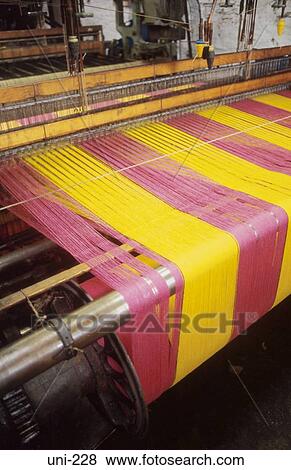 Loom Producing Pink and Yellow Cloth Wales UK View Large Photo Image Stock Photo - Loom Producing Pink and Yellow Cloth Wales UK. Fotosearch