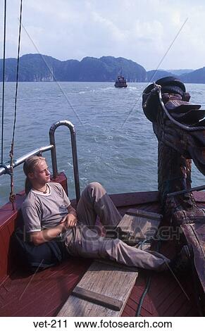 Man Asleep on Boat Halong Bay Vietnam View Large Photo Image Stock Image - Man Asleep on Boat Halong Bay Vietnam. Fotosearch
