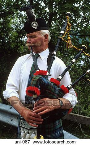 Man in Traditional Dress Playing Bagpipes Scotland View Large Photo Image Stock Photo - Man in Traditional Dress Playing Bagpipes Scotland. Fotosearch