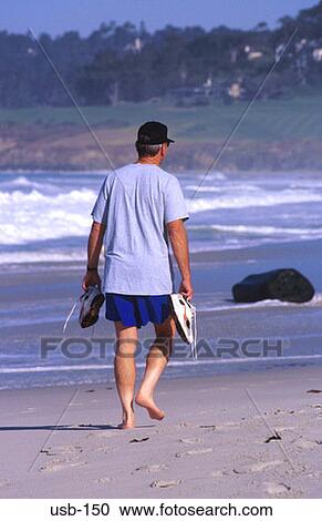 Man Walking Barefoot on Beach Carmel California USA View Large Photo Image Stock Image - Man Walking Barefoot on Beach Carmel California USA. Fotosearch