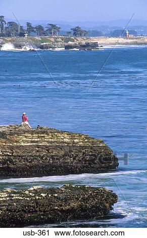 Man Watching Sea From Rocky Beach USA View Large Photo Image Stock Image - Man Watching Sea From Rocky Beach USA. Fotosearch