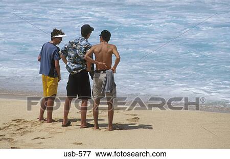 Men on Beach Hawaii USA View Large Photo Image Stock Photo - Men on Beach Hawaii USA. Fotosearch
