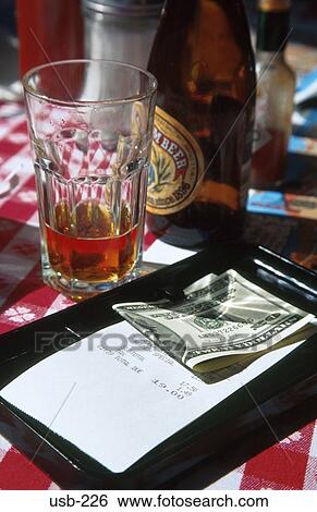 Stock Photograph - Money and Restaurant Bill USA. Fotosearch