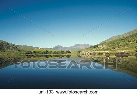 Mountain Landscape Reflected in Still Lake Wales UK View Large Photo Image Stock Image - Mountain Landscape Reflected in Still Lake Wales UK. Fotosearch