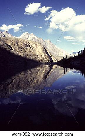 Stock Image - Mountains Reflecting in Lake Pakistan. Fotosearch