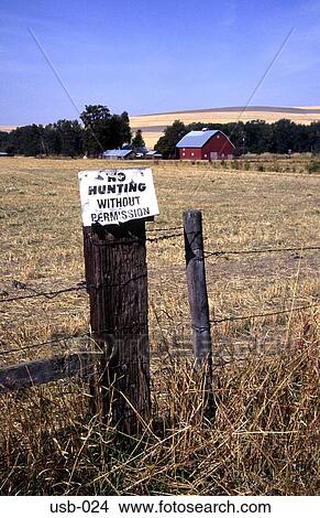 Picture - No Hunting Sign on Fence Post Washington State USA. Fotosearch