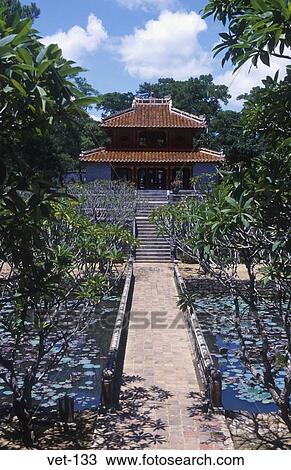 Stock Image - Path through Gardens Tomb of Minh Mang Vietnam. Fotosearch