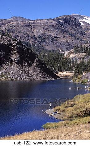 Stock Image - People by Tanaga Lake Yosemite National Park USA. Fotosearch