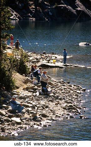 People Fishing on Rocky Riverbank USA View Large Photo Image Picture - People Fishing on Rocky Riverbank USA. Fotosearch