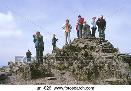 Stock Photograph - People on the Summit of Mt Snowdon Snowdonia National Park Wales UK. Fotosearch