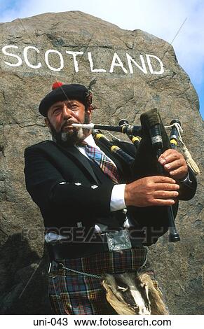 Piper in Front of Scotland Sign UK View Large Photo Image Stock Image - Piper in Front of Scotland Sign UK. Fotosearch