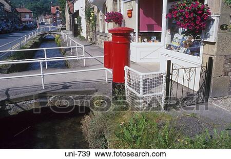 Red Post Box by Village Stream Yorkshire UK View Large Photo Image Stock Photo - Red Post Box by Village Stream Yorkshire UK. Fotosearch