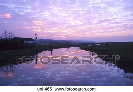 Reflection of Broken Cloud in River at Sunset Wales View Large Photo Image Stock Photograph - Reflection of Broken Cloud in River at Sunset Wales. Fotosearch