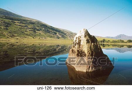 Rock Pinnacle Reflected in Still Lake Wales UK View Large Photo Image Stock Photograph - Rock Pinnacle Reflected in Still Lake Wales UK. Fotosearch