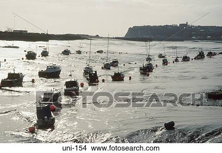 Picture - Small Boats on Mudflats Cardiff Bay Wales UK. Fotosearch