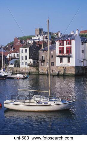 Stock Image - Small Sailing Boat Whitby UK. Fotosearch