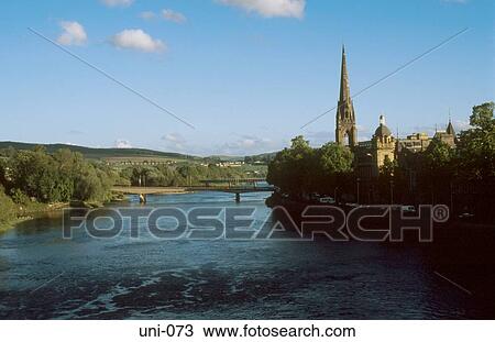 Stock Image - Small Town in Verdant Countryside Scotland. Fotosearch