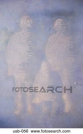 Stock Photograph - Soldiers formed from Names of the Dead on Memorial. Fotosearch