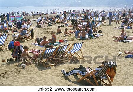 Stock Image - Sunbathers on Scarborough Beach. Fotosearch