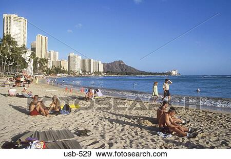 Sunbathing on Waikiki Beach Oahu Hawaii USA View Large Photo Image Stock Photo - Sunbathing on Waikiki Beach Oahu Hawaii USA. Fotosearch