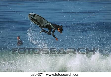 Surfer Jumping Wave Santa Cruz USA View Large Photo Image Stock Image - Surfer Jumping Wave Santa Cruz USA. Fotosearch