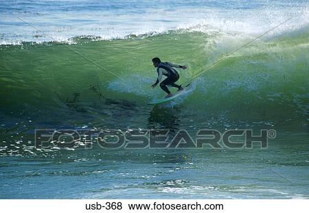Stock Photo - Surfer Riding a Wave Santa Cruz California USA. Fotosearch