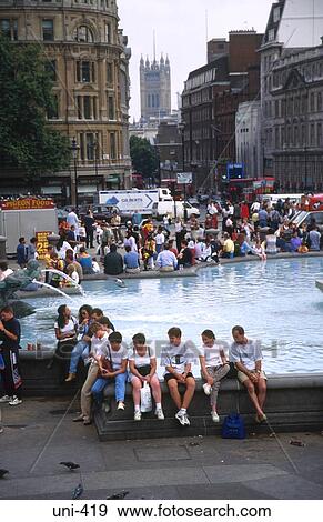 Tourists by Fountain Trafalgar Square London UK View Large Photo Image Stock Photo - Tourists by Fountain Trafalgar Square London UK. Fotosearch