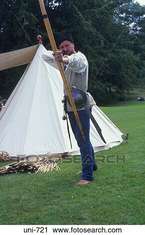 Stock Image - View of Archer Aiming Bow. Fotosearch