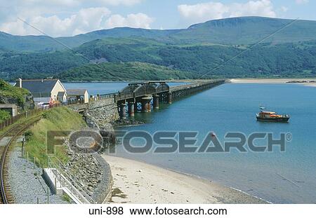 Stock Photo - View of Barmouth Railway Bridge and Bay Wales UK. Fotosearch