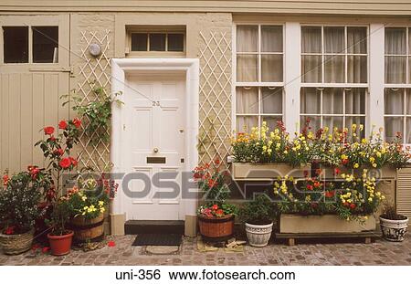 Stock Photograph - Windowboxes and Flowerpots Outside House. Fotosearch