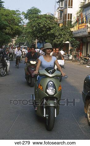 Woman on Motorbike Hanoi Vietnam View Large Photo Image Stock Photo - Woman on Motorbike Hanoi Vietnam. Fotosearch