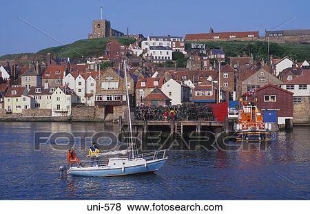 Yacht Entering Whitby Harbour UK View Large Photo Image Stock Photo - Yacht Entering Whitby Harbour UK. Fotosearch