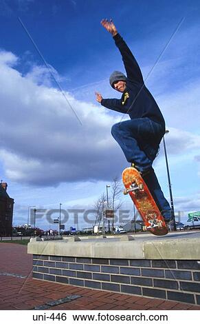 Youth Jumping with Skateboard Wales View Large Photo Image Stock Photograph - Youth Jumping with Skateboard Wales. Fotosearch
