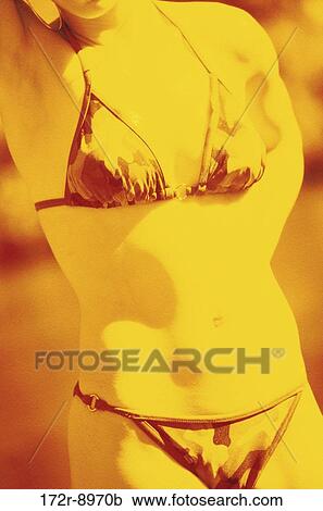 Stock Image - danger, woman, sun, heat, bikini, torso. Fotosearch