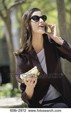 eating, woman, telephone, talking, conversation, phone, sunglasses View Large Photo Image Stock Image - eating, woman, telephone, talking, conversation, phone, sunglasses. Fotosearch