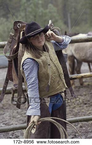 fence, woman, rope, western, carrying, vest, horses View Large Photo Image Stock Photograph - fence, woman, rope, western, carrying, vest, horses. Fotosearch