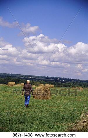 Stock Photo - Field, farm, farming, people, walking, farmer. Fotosearch