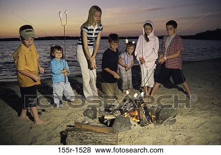 fire, group, people, water, dusk, roast View Large Photo Image Stock Photo - fire, group, people, water, dusk, roast. Fotosearch