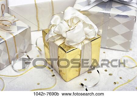 gold, celebration, confetti, gift, present, elegant, still life View Large Photo Image Stock Image - gold, celebration, confetti, gift, present, elegant, still life. Fotosearch