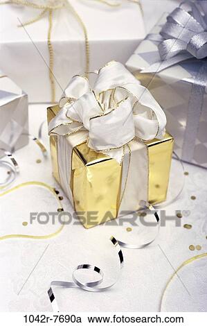 gold, celebration, confetti, gifts, presents, ribbon, elegant View Large Photo Image Stock Image - gold, celebration, confetti, gifts, presents, ribbon, elegant. Fotosearch