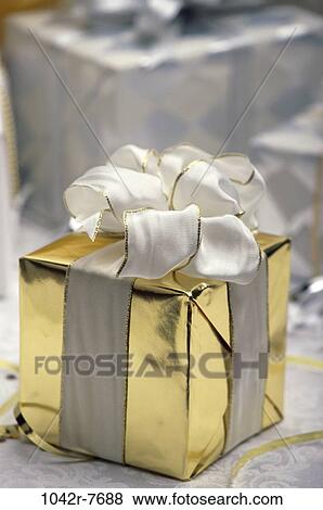 gold, gift, present, ribbon, elegant, still life, bow View Large Photo Image Stock Photo - gold, gift, present, ribbon, elegant, still life, bow. Fotosearch