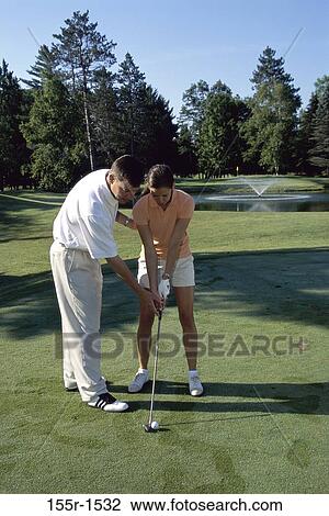 Stock Image - golf, teacher, concentration, sports, challenges, achievement, accuracy. Fotosearch