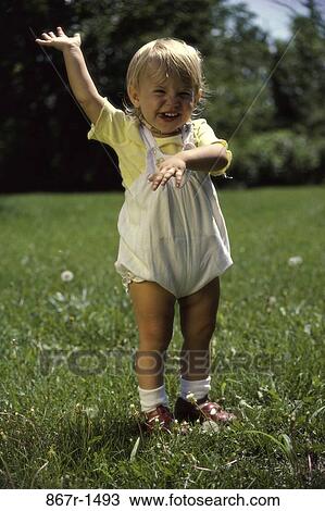 grass, people, smiling, baby, girl, standing, outdoors View Large Photo Image Stock Image - grass, people, smiling, baby, girl, standing, outdoors. Fotosearch