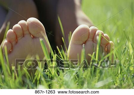 grass, relaxed, body parts, relaxing, feet, relax, toes View Large Photo Image Stock Image - grass, relaxed, body parts, relaxing, feet, relax, toes. Fotosearch