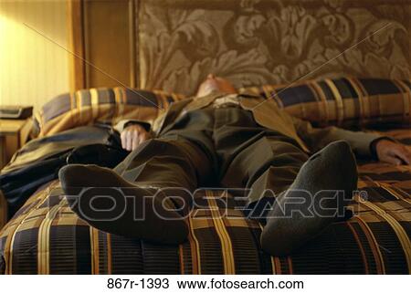 Stock Image - hotel, sleeping, exhaustion, bed, business. Fotosearch