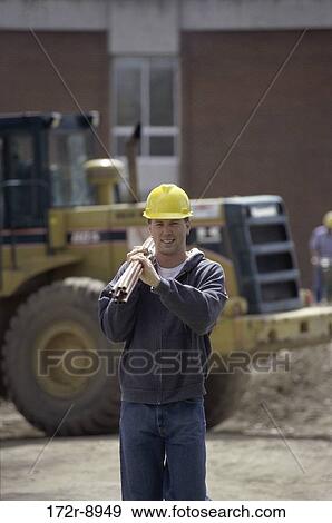 industry, construction, worker, carrying, machinery View Large Photo Image Stock Photo - industry, construction, worker, carrying, machinery. Fotosearch