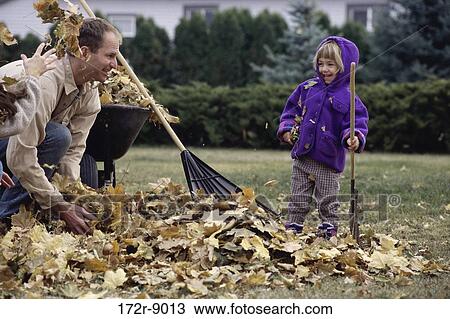 Stock Image - leaves, people, playing, laughing, playful, outdoors. Fotosearch