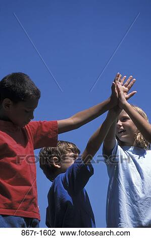 Stock Image - multiethnic, people, outdoors, unity, children, agreement. Fotosearch