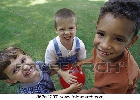 Stock Photo - multiethnic, people, playing, ball, outdoors, children, play. Fotosearch